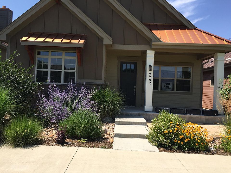Front of House with patio facing Park