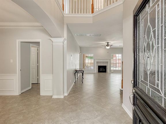 Gorgeous tile set on the diagonal greets you as you enter this beautiful home.