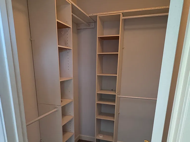 Primary walk-in closet.