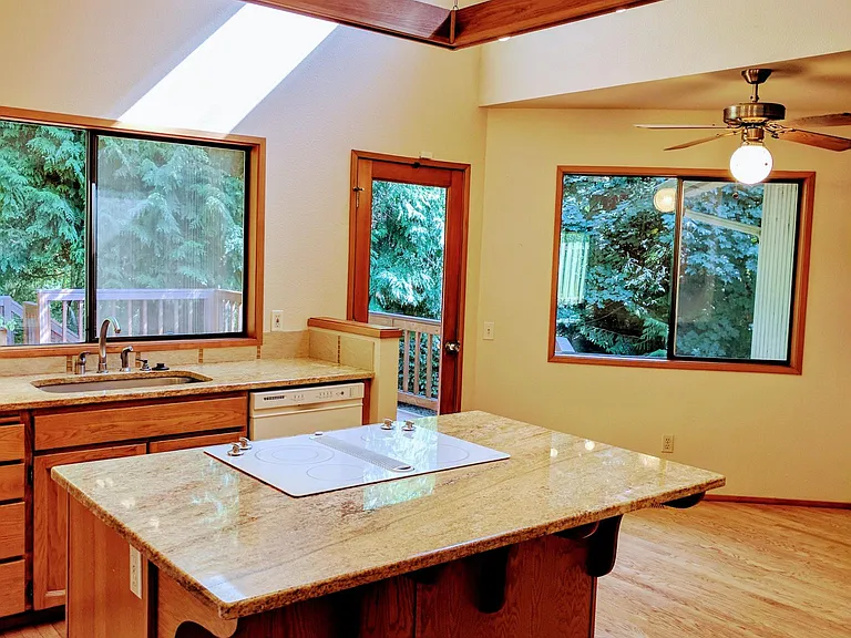 Enjoy sunlight-inviting windows and a breakfast nook.