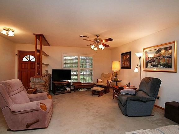 The living area, has plantation shutters