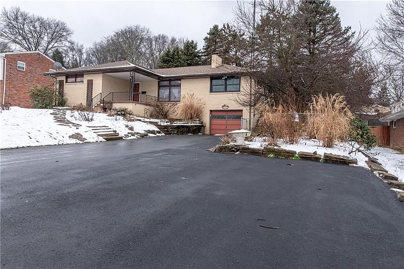 Extended driveway makes entertaining easy with additional parking.