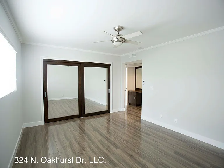 Bedroom has Large Mirrored Closet Doors