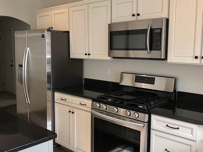 gas cooktop and built-in microwave.