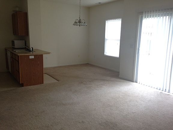 Living space with sliding glass door out to your patio