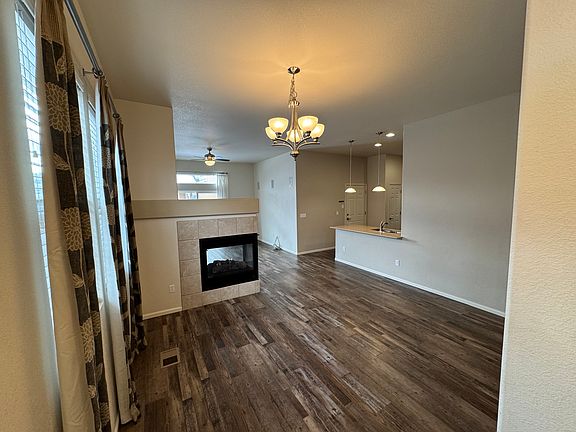 Entryway into sitting area facing double sided fireplace.
