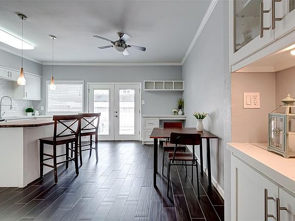 The kitchen area has a built in office nook and room for a breakfast table.