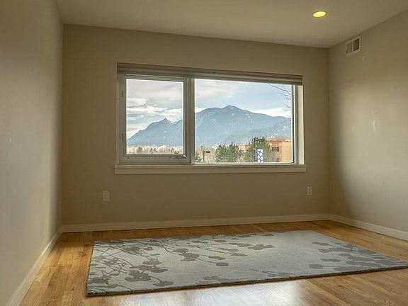 Living room and Flatirons view