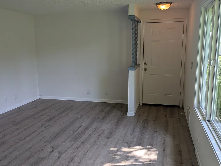 Living room angle 4, front door.