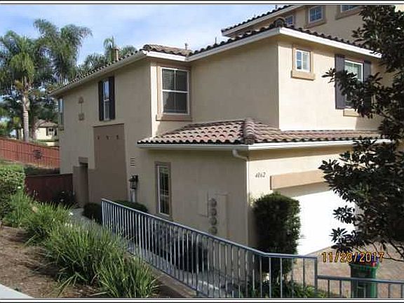 Side with sidewalk to front door