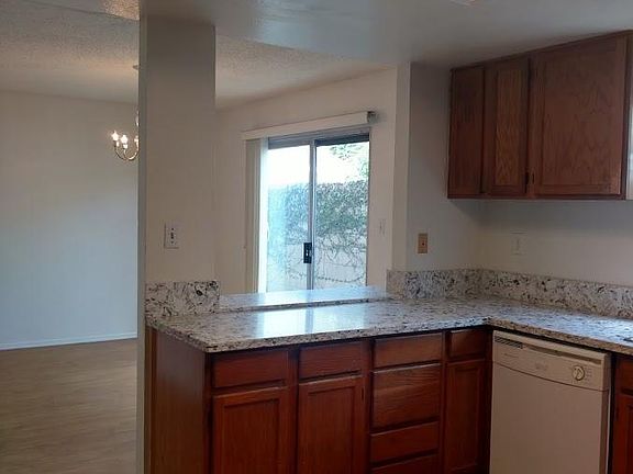 Kitchen with view of dining and private patio from the dining room.