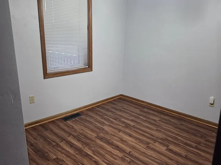 Main Floor Dining Space with Window Coverings Throughout