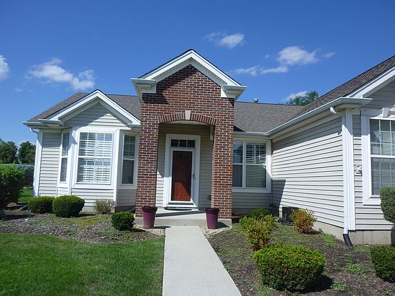 Covered entry, brick front