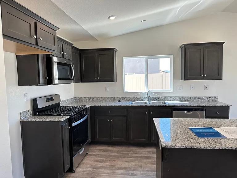 Kitchen with stove, microwave, refrigerator and dishwasher included