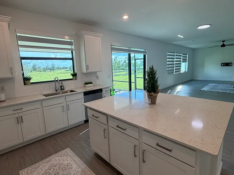 VIEW FROM KITCHEN AND EXTRA LARGE FAMILY ROOM