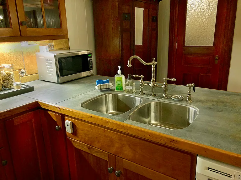 Gorgeous porcelain tile and nickle-plated stylish faucets make this sink a joy to use!