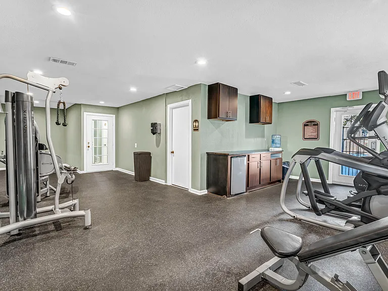 Fully equipped fitness center with cardio and strength-training equipment.