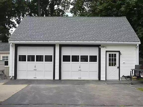 Garage. Door area access side shop area and upstairs is available for storage. Electric doors.