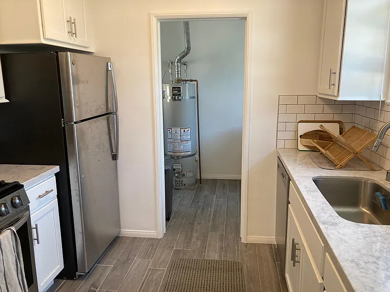 Kitchen entrance (from dining room) to laundry room - previous tenant A
