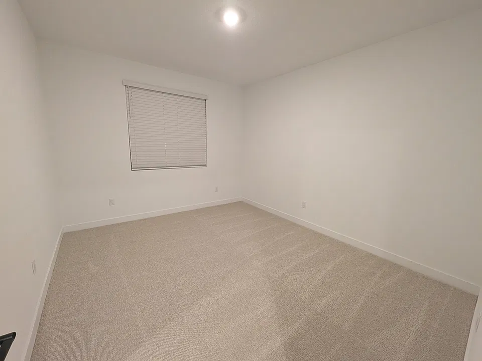 Large 13' x 11' bedroom with carpeted floor