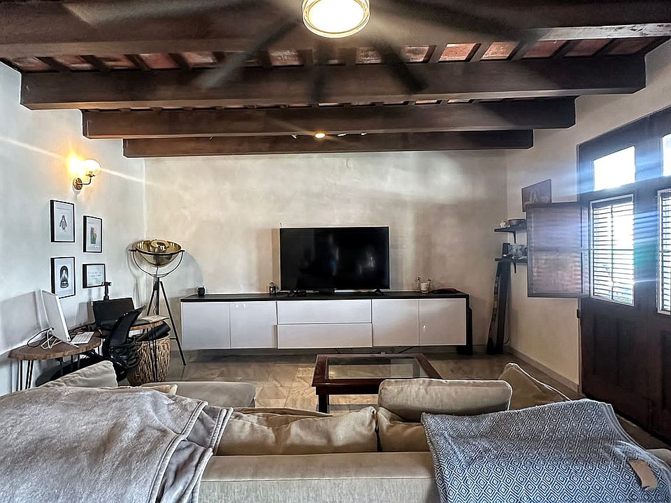 living room with double doors that lead out to terrace