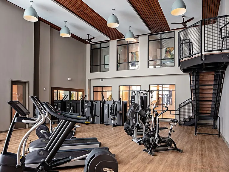 Two-level fitness center with cardio and strength equipment