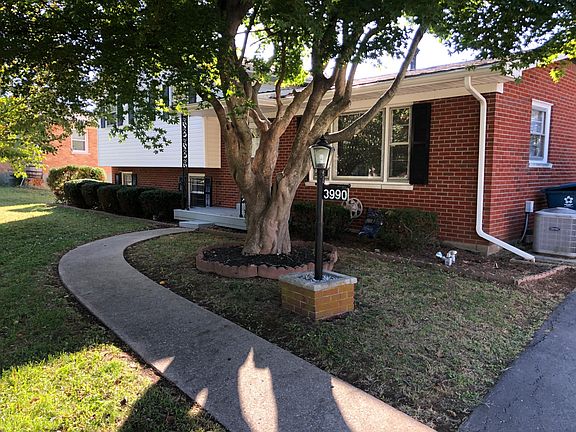 Front of the House with Sidewalk to Driveway