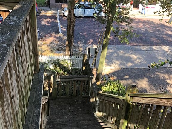 One entrance is from the street and the sidewalk location, and the other is from the private parking area in the rear of the building.