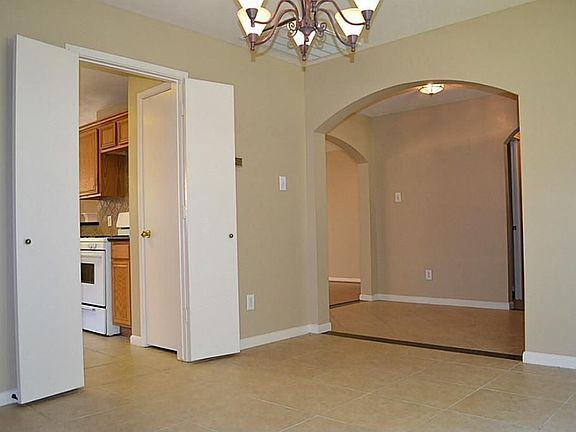 View from dining room looking into custom granite and tile entry