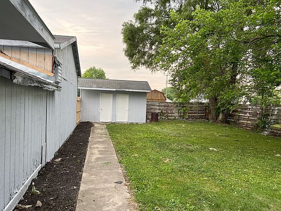 Side view of garage and shed
