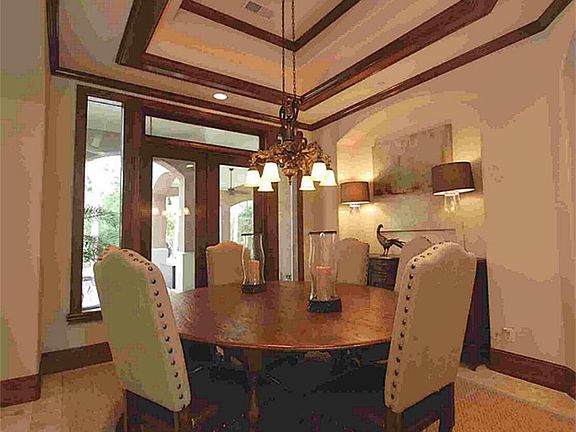 Elegant Formal Dining room with a view romantic view of the Lanai's and pool area.