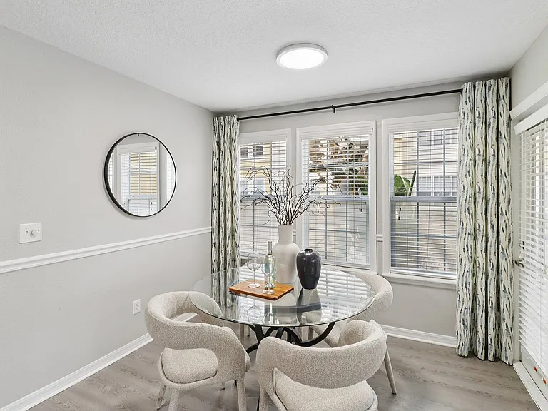 Bright dining space with elegant seating and natural light