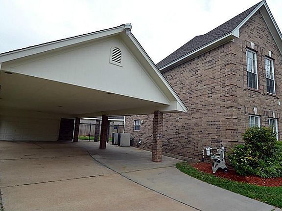 The home has a huge porte-cochere, perfect for protection of your vehicle or using as a work area on the weekends.