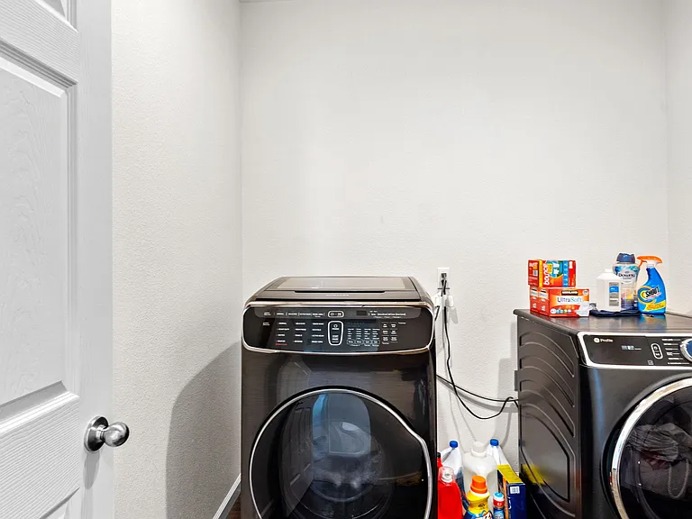 Upstairs Laundry room with ample room for a full size washer and dryer