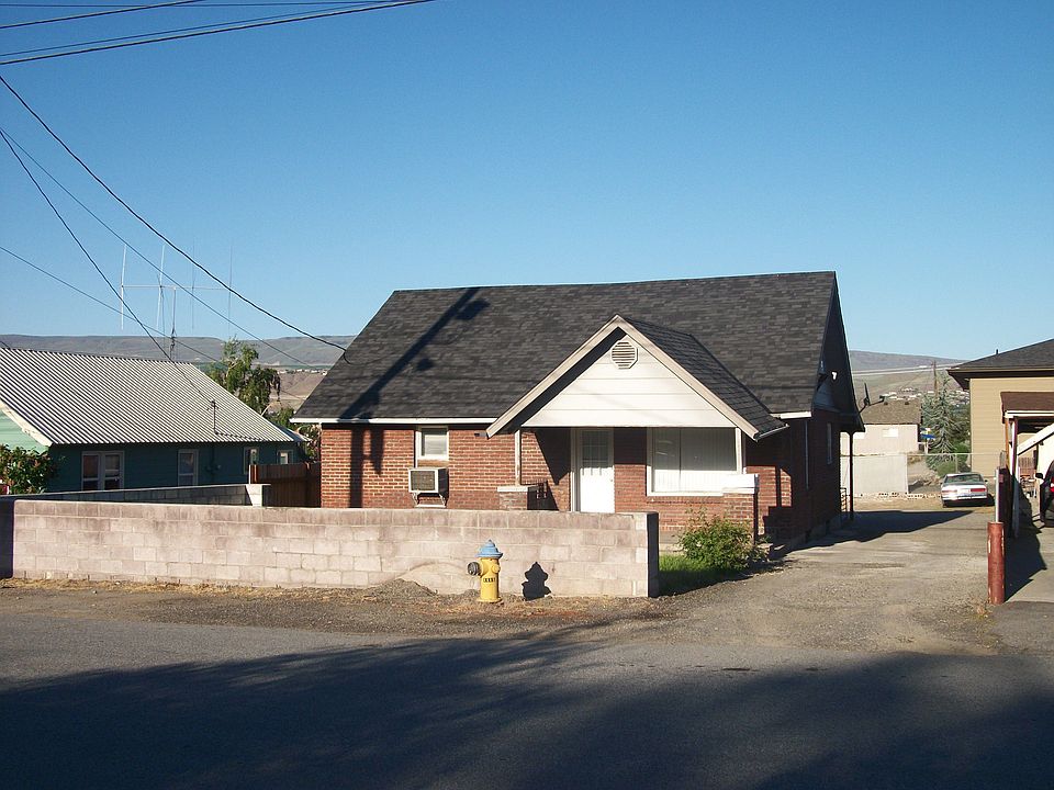 Front view with stone wall
