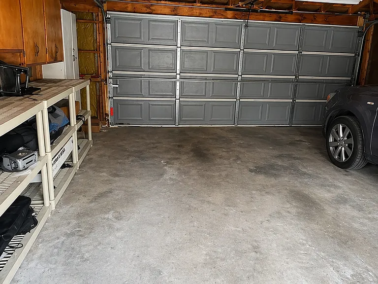 Garage, with 1 space designated for 1st Floor and EZ fast charger included.
