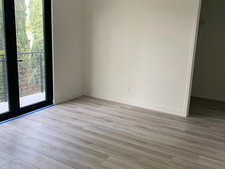 primary bedroom with balcony