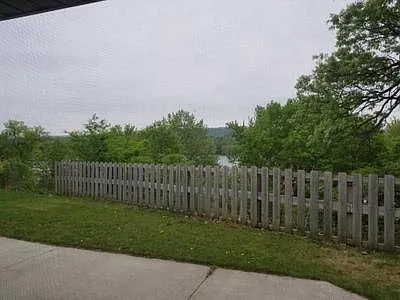 Private backyard and privacy fence along the bluff. Views of backchannel. - W8043 140th Ave
