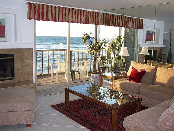 comfortable living room with raised hearth fireplace