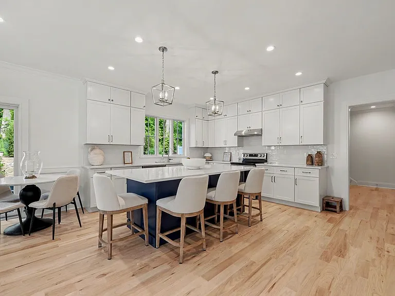 Featuring custom cabinetry, expansive quartz countertops, and professional-grade appliances.
