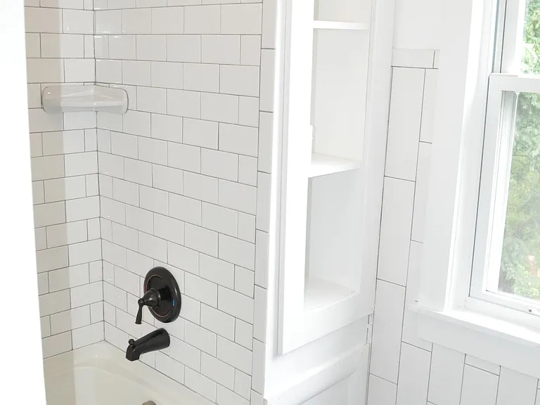 Newly Tiled and added storage shelves.