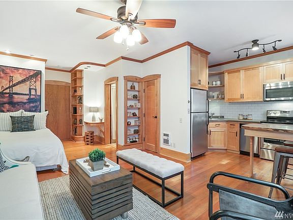 You will be greeted by classic warm Fir wood floors. All Custom built doors and casings for closet made from reclaimed western maple, and vertical grain fir wood panels. Stunning New ceiling fan and the most organized, user friendly built in bed nook! 