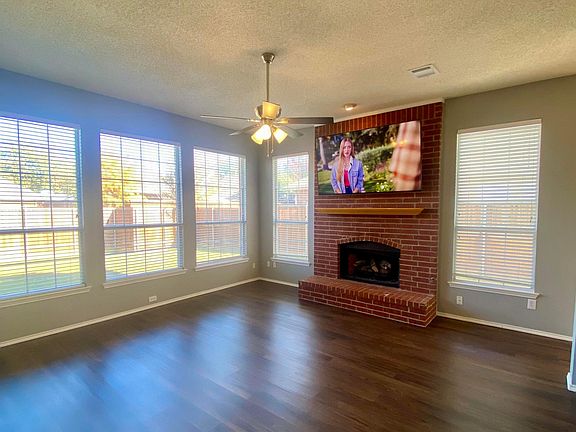 Family Room with Gas Log Fireplace, Sony Smart TV & Satellite Television