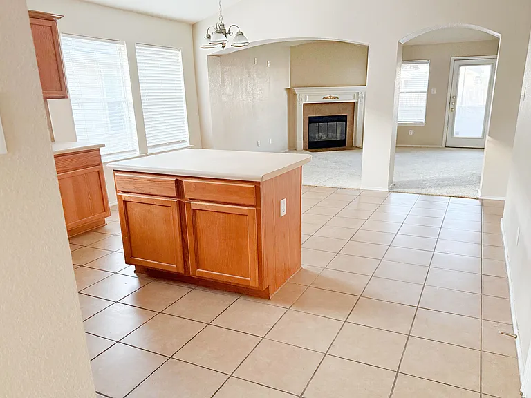 Kitchen island cabinet and eating area for stools.