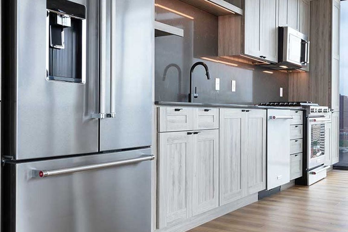 Penthouse-level Signature Collection apartment homes feature kitchens with upgraded appliances