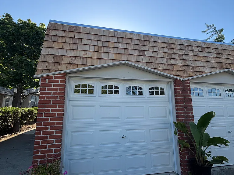 Assigned garage with additional driveway parking.