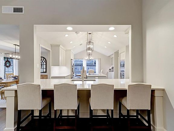 The living area has been remodeled to provide an open floor plan with incredible flow from the living room, dining room and kitchen. Easy social gathering at this welcoming counter invites easy interaction with family and friends.