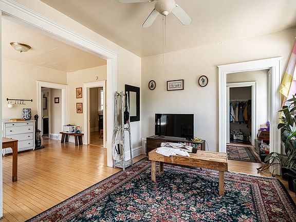 living room looking toward master bedroom (on right) & dining room (at left)