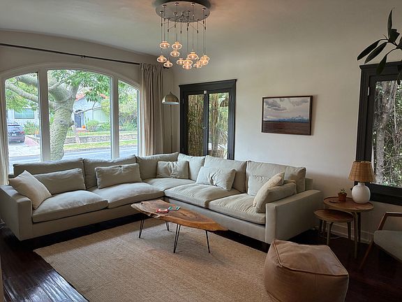 Living room with picture window and gas fireplace