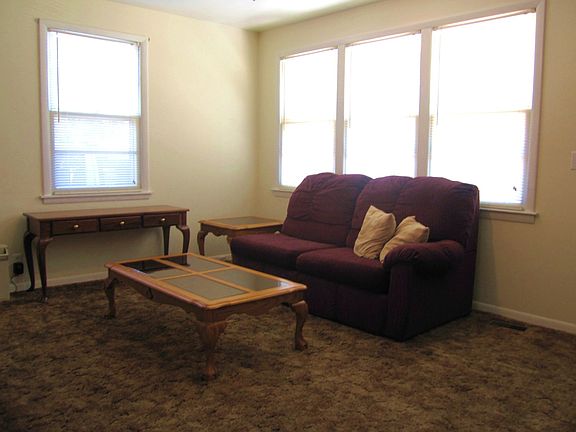 Front living room with hardwoods under the carpet